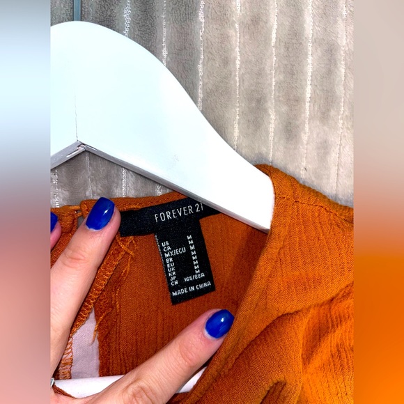 Orange blouse with ruffles on the sides. Super cute for the office or a date! - Picture 3 of 3